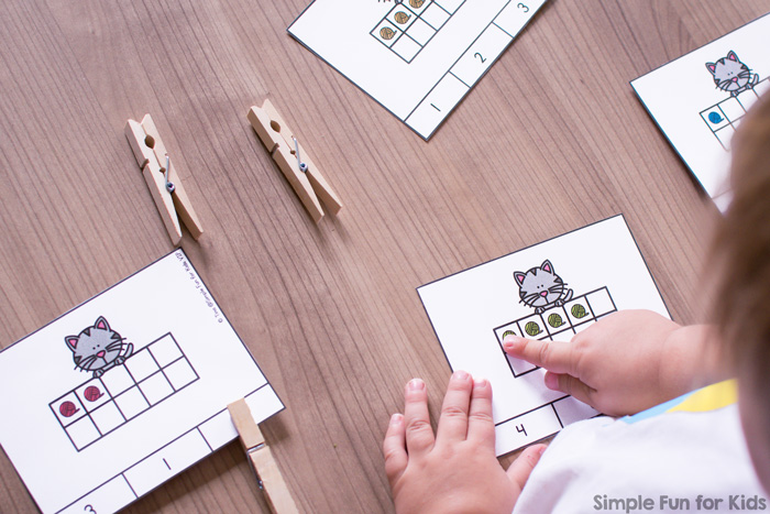 Fun counting and fine motor practice for preschoolers with this set of cute printable Cat and Yarn 10 Frame Counting Clip Cards.